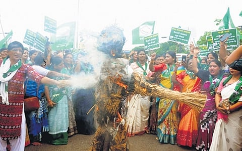 BMJD members burning effigy of Khatua seeking his arrest, on Thursday