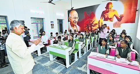 Chief Minister N Chandrababu Naidu teaches a Social Science lesson on resource utilisation to eighth class students at the Zilla Parishad High School in Kothacheruvu of Sri Sathya Sai district.