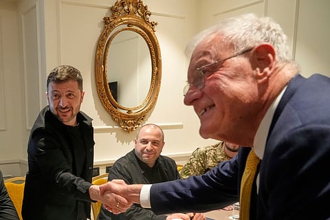 Ukraine President Volodymyr Zelenskyy, left, shakes hands with United States Special Envoy for Ukraine and Russia, Joseph Keith Kellogg, during their meeting in Rome, Italy, Wednesday, July 9, 2025.