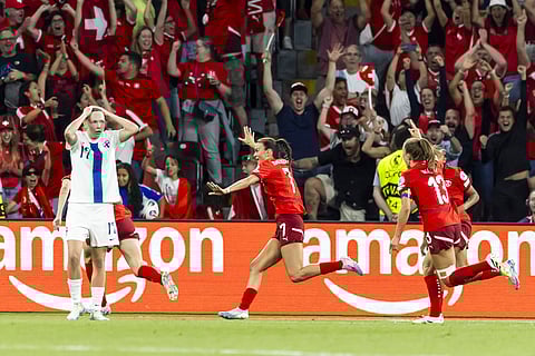 Switzerland's Riola Xhemaili, center, celebrates after scoring her side's goal during the UEFA Women's EURO 2025, group A, soccer match between Finland and Switzerland in Geneva, Switzerland, Thursday, July 10, 2025.