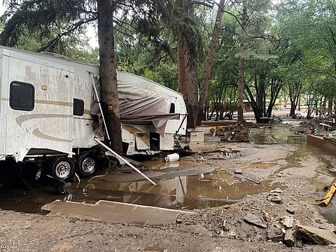 In this photo provided by Jean Meairs, damage from a flood that tore through the Riverview RV Park along the Rio Ruidoso is seen, Tuesday, July 8, 2025, in Ruidoso, N.M.