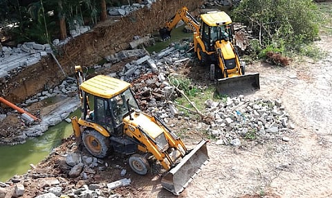 Structures, including those belonging to NRC and NKNR function halls, were demolished amid tight police security.