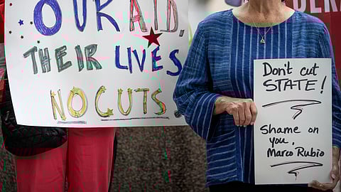 Federal workers and supporters rally outside of the State Department, June 27, 2025, in Washington.