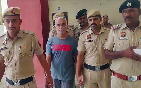 Deepak Yadav, 49-year old man accused in the murder of her daughter and former tennis player Radhika Yadav, being brought to a court, in Gurugram, Friday, July 11, 2025. The 25-year-old former player was allegedly shot dead by her father at the family's double-storey home in the upscale Sushant Lok area of Gurugram on Thursday.