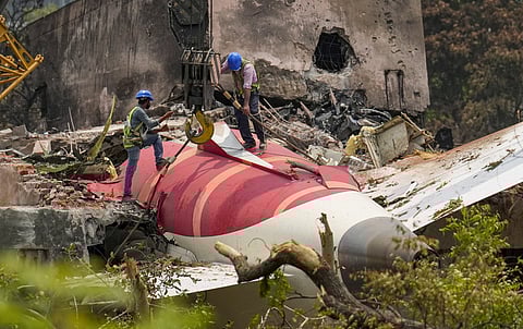wreckage of the crashed Air India plane, which crashed into a medical college hostel in Ahmedabad