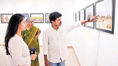 Kavali Chandrakanth points to an exhibit at the State Art Gallery in Madhapur
