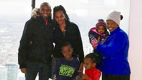 This photo taken in Toronto, in Dec. 2018, shows Paul Njoroge, his wife, Carolyne, and three small children, Ryan, age 6, Kellie, 4, and infant Rubi, along with Njoroge’s mother-in-law, Anne Wangui Karanja.