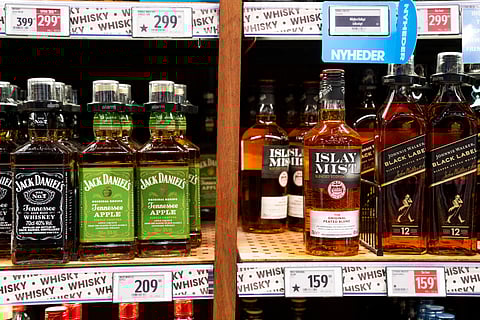 FILE - Bottles of spirits are labeled with a star in Bilka in Randers, Denmark, making it easier for customers to buy European goods, Monday, March 17, 2025.