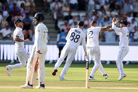 England's Brydon Carse celebrates with teammates after the dismissal of India's captain Shubman Gill, during the fourth day of the third test match.