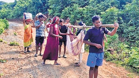 Family members carrying the tribal woman in a doli on Sunday
