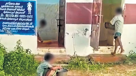 Students cleaning toilets at a primary school in Pudukkottai