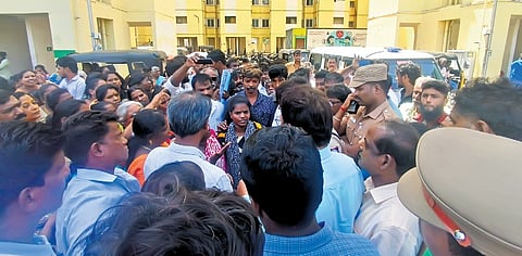 Residents of TNUHDB tenements at TT Block, Sathyamoorthy Nagar in Vyasarpadi, stage a protest on Monday