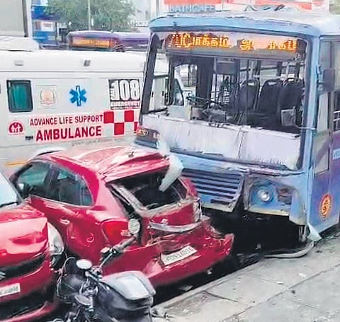 The bus came to a halt after crashing into cars parked outside a hotel at Arumbakkam in Chennai on Sunday