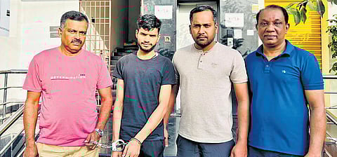 The special investigation team along with the accused (second left)