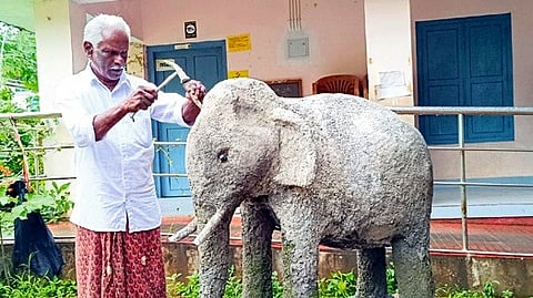 Govindhan P P working on the elephant sculpture at GLPS Kozhummal in Kannur
