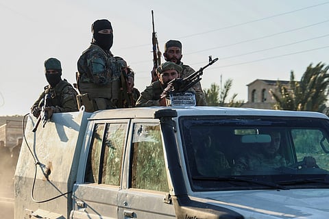 Syrian government forces deploy at the Mazraa village on the outskirts of city of Sweida, where clashes erupted between Sunni Bedouin clans and Druze militias, southern Syria, Monday