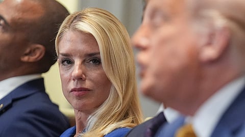 Attorney General Pam Bondi, left, listens as President Donald Trump, right, speaks during a cabinet meeting at the White House, Tuesday, July 8, 2025, in Washington