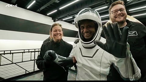 In this image made from video provided by SpaceX, one of the four astronauts, India's Shubhanshu Shukla, waves as he comes out of a SpaceX capsule loaded at the recovery ship after parachuting into the Pacific Ocean off the coast of Southern California on Tuesday, July 15, 2025.