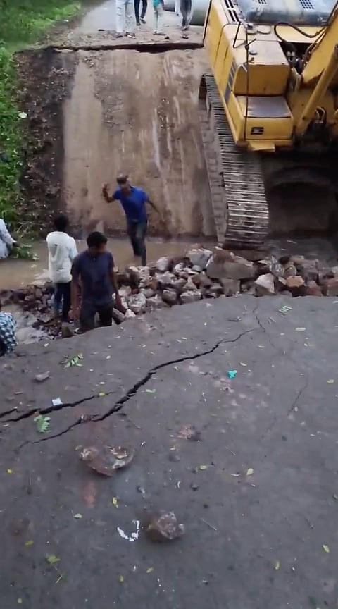 The bridge, a crucial link between Keshod and Madhavpur and frequented by thousands of vehicles daily, gave way while a breaker machine was operating on it, sending the machine and eight to ten people standing on the slab plunging nearly 15 feet into the river below.