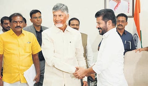 AP CM Chandrababu Naidu greets Telangana CM Revanth Reddy before the meeting with Union Minister of Jal Shakti CR Patil in New Delhi on Wednesday