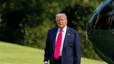 US President Donald Trump walks from Marine One after arriving on the South Lawn of the White House, Tuesday, July 15, 2025, in Washington.