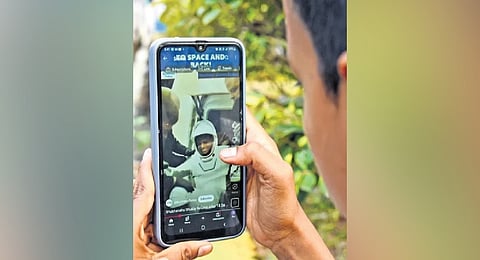 A student watches the live feed of Shubhanshu Shukla’s return