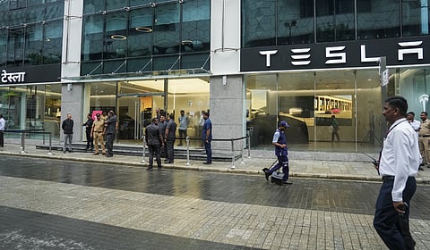 Tesla rolls in, but bumps stay on EV growth path