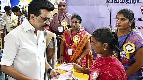 Stalin interacting with a beneficiary in Chidambaram on Tuesday