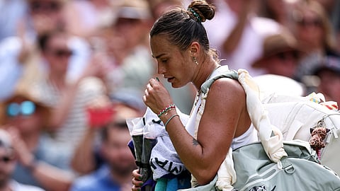 Belarus's Aryna Sabalenka reacts as she leaves Centre Court following her defeat against US player Amanda Anisimova during their women's singles semi-final tennis match at the 2025 Wimbledon Championships.