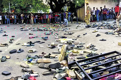 Footwears lie on the ground outside the Chinnaswamy Stadium following a stampede after a large number of fans gathered for the felicitation of IPL 2025 winning RCB team, in Bengaluru, Karnataka, Wednesday, June 4, 2025.