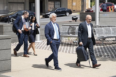 Former White House Chief of Staff Jeffrey Zients, center, arrives at the Court of Chancery on Wednesday, July 16, 2025, in Wilmington, Del.