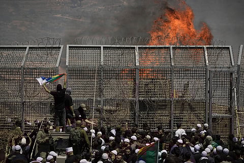 Druze from Syria and Israel protest on the Israeli-Syrian border, in Majdal Shams in the Israeli-controlled Golan Heights, Wednesday, July 16, 2025, amid the ongoing clashes between Syrian government forces and Druze armed groups in the southern Syrian city of Sweida.
