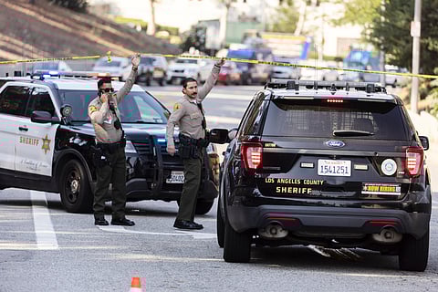 Sheriffs deputies monitor a street closure near the site of an explosion at the LA County Sheriff's Special Operations Bureau on Friday, July 18, 2025, in Los Angeles.