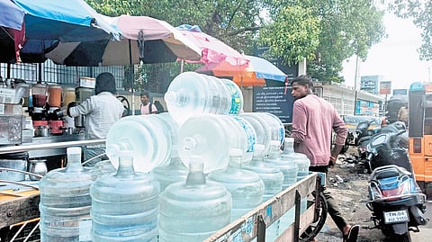 Water bottles and water cans for sale near the hospital