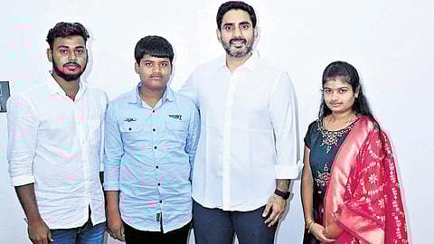 HRD Minister Nara Lokesh with the family members of Boya Narasimhulu, who fell victim to factionalism in Rayalaseema, at his residence in Undavalli