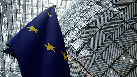 The European Union flag stands inside the atrium at the European Council building in Brussels, June 17, 2024.