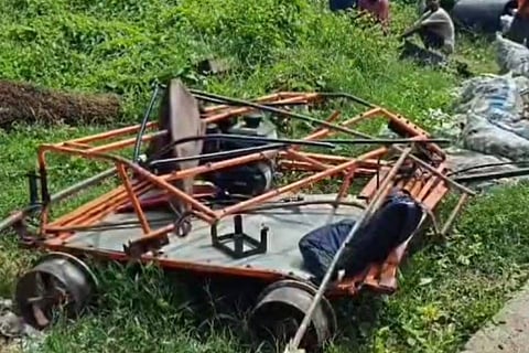 Railway staff attempted to remove thr push trolley, but its umbrella got entangled with the moving goods train.