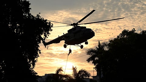 NSG personnel descend from a chopper during a counter-terrorism mock drill near The Claridges hotel, in New Delhi on Thursday, July 17, 2025.