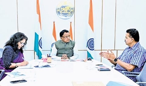 CM Majhi in discussion with Mahtab and development commissioner Anu Garg at Lok Seva Bhawan.