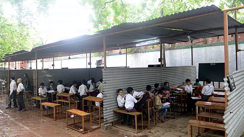 School children at Qaumi Senior Secondary School, run inside Eidgah near Jhandewala, New Delhi