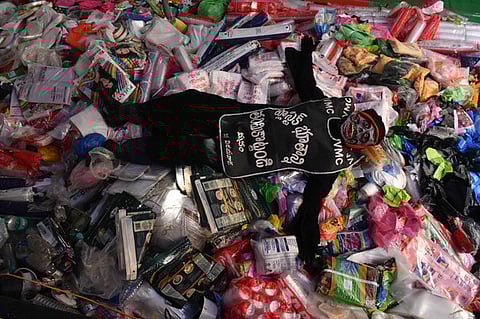 A person in plastic devil attire creates awareness on usage of single use plastic during a meeting organised as a part of Swachh Andhra campaign.