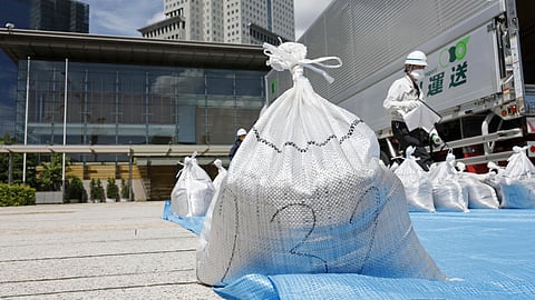 A bag of soil, slightly radioactive but decontaminated one from Fukushima, is delivered to the Japanese prime minister's office to be reused in the garden, in Tokyo, Japan, Saturday, July 19, 2025