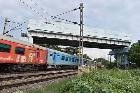 Southern Railway completed its share of the works above the track in 2018. Progress stalled soon after due to prolonged land acquisition issues.