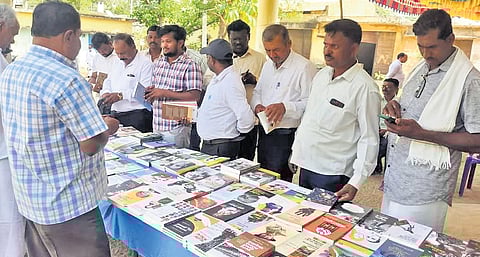 Bibliophiles look at works published by Ladai Prakashana at one of the May Sahitya Sammelans.