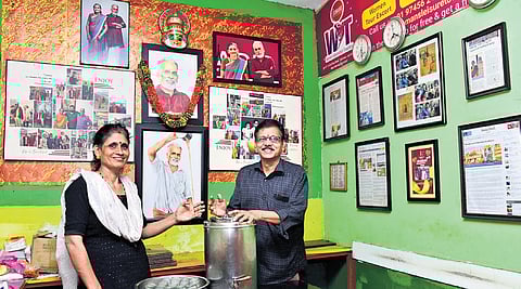 Usha V Prabhu, K R Vijayan’s daughter, and husband Muralidhara Pai at their tea stall at Gandhinagar in Kochi. Pictures of her parents’ foreign trips can also be seen on the shop’s walls