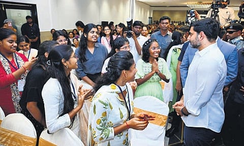 HRD and IT Minister Nara Lokesh interacting with CA students after inaugurating ‘Spoorthi,’ a Mega CA Students Conference, in Guntur on Saturday