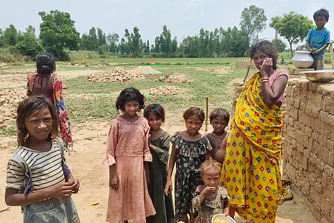 Children who work with their families at a brick kiln, in Aligarh district, Uttar Pradesh, Wednesday, May 28, 2025.