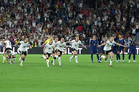 Players of Germany run to celebrate after winning the Women's Euro 2025 quarterfinals soccer match between France and Germany at St. Jakob-Park in Basel, Switzerland, Saturday, July 19, 2025.