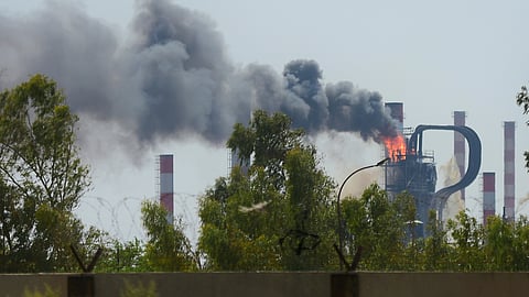 Smoke and flame rise up in a unit of the Abadan oil refinery in southwestern Iran, Saturday, July 19, 2025.