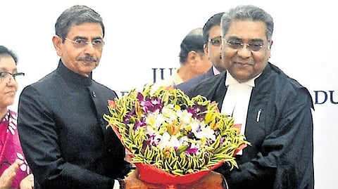 Governor R N Ravi felicitating the CJ of the Madras HC, Justice Manindra Mohan Shrivastava, on Monday
